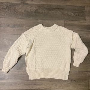 Cozy cream sweater with side slits